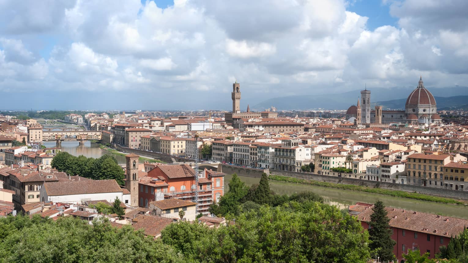 Daytime view over Florence rooftops, houses, cathedrals