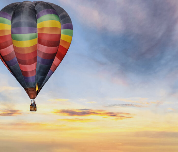 Hot Air Balloon In Colorful Sunrise Sky